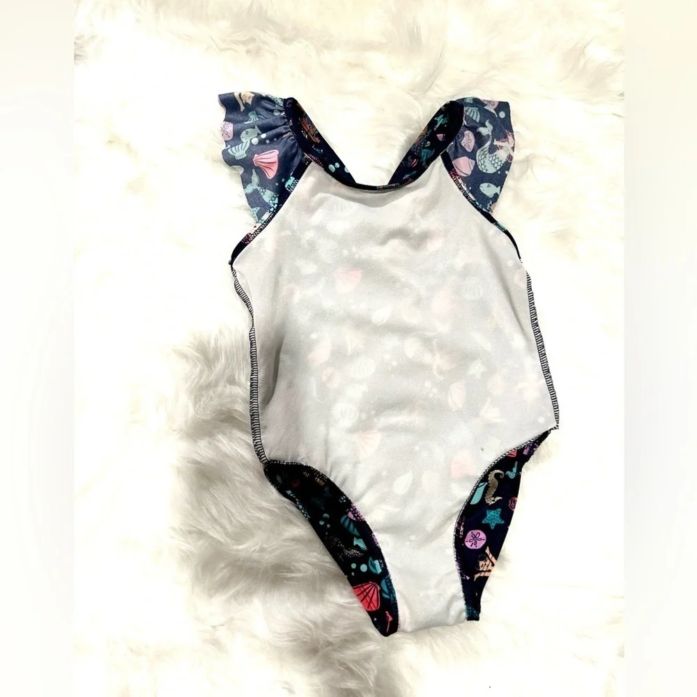 CAT & JACK BATHING SUIT | NAVY BLUE BACKGROUND WITH MERMAIDS & SHELLS